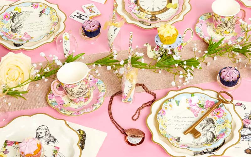 Alice in Wonderland tea party table with themed tableware