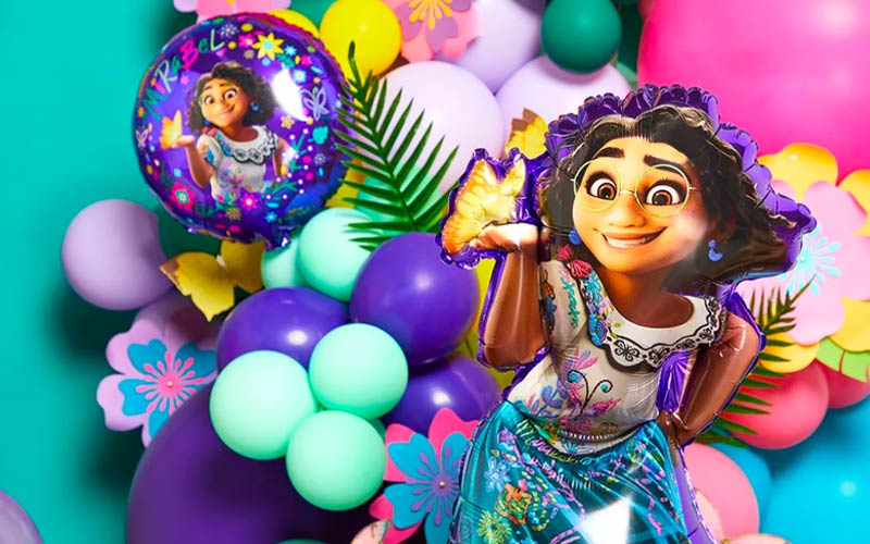 How to Throw an Encanto Party Encanto balloon arch with Mirabel balloons