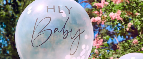 Baby shower balloon in a garden