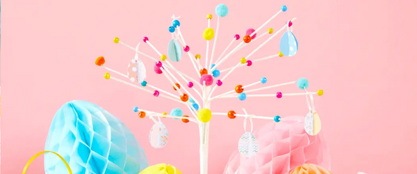 DIY Easter Tree and Decorations A fully decorated Easter tree surrounded by bunnies in baskets and honeycomb eggs