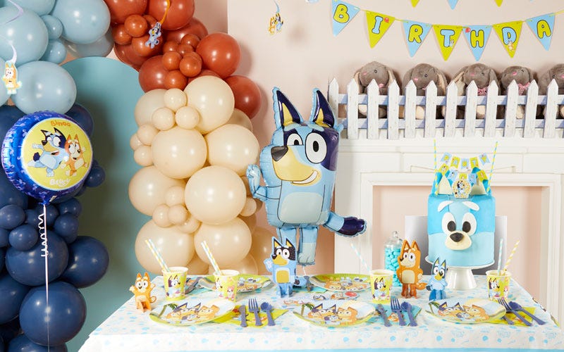 A Bluey birthday party for kids with licensed balloons, decorations and tableware and a homemade Bluey birthday cake