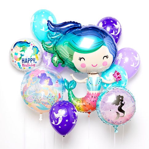 10 different mermaid themed balloons on a white background. There are a range of foil and latex mermaid balloons and a giant mermaid balloon with blue and green hair in the centre.