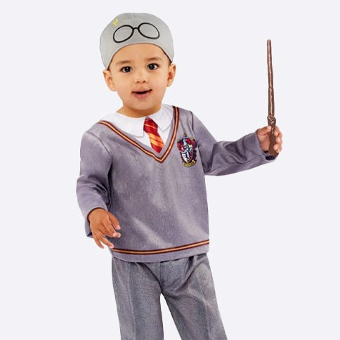 Toddler dressed as Harry Potter with wand