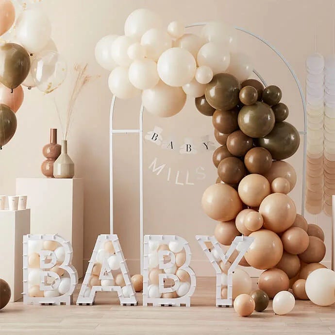 Neutral baby shower decorations Neutral baby shower decorations with a balloon arch, balloon mosaics and a banner