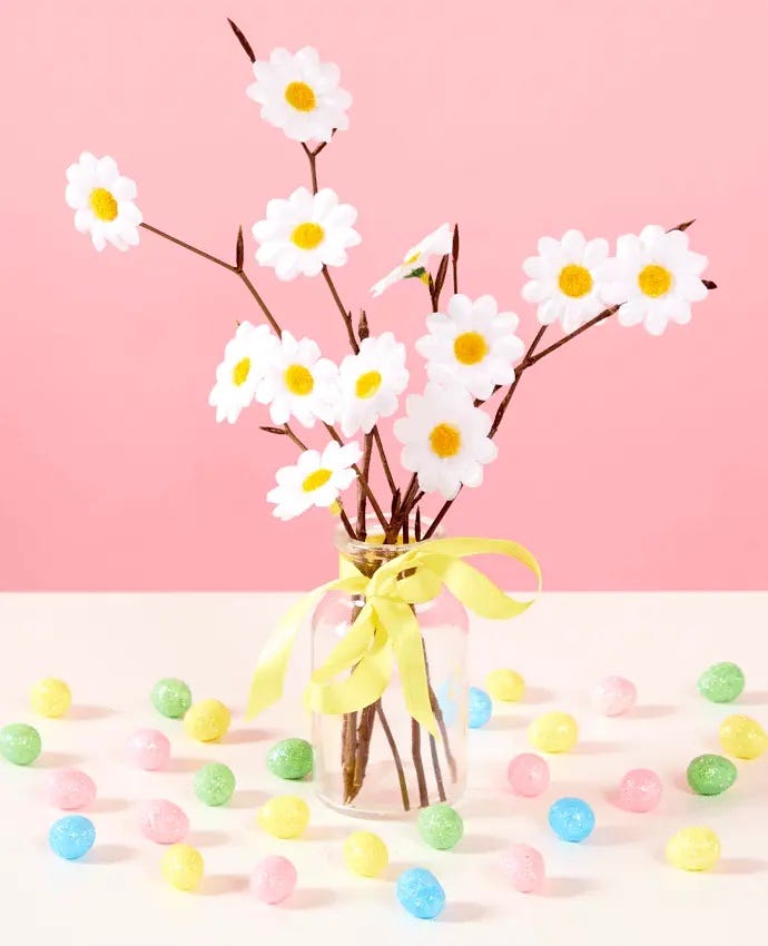 A DIY Easter tree surrounded by Easter eggs