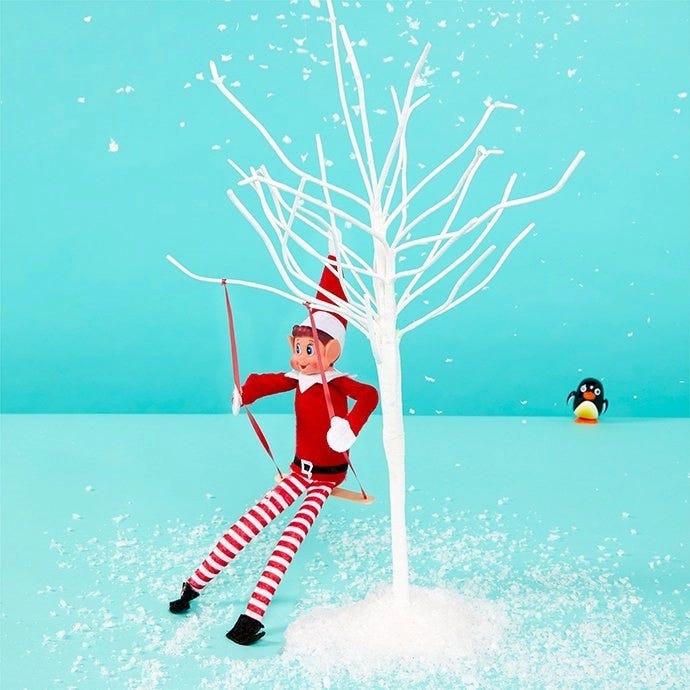 Elf on the Shelf on a swing
