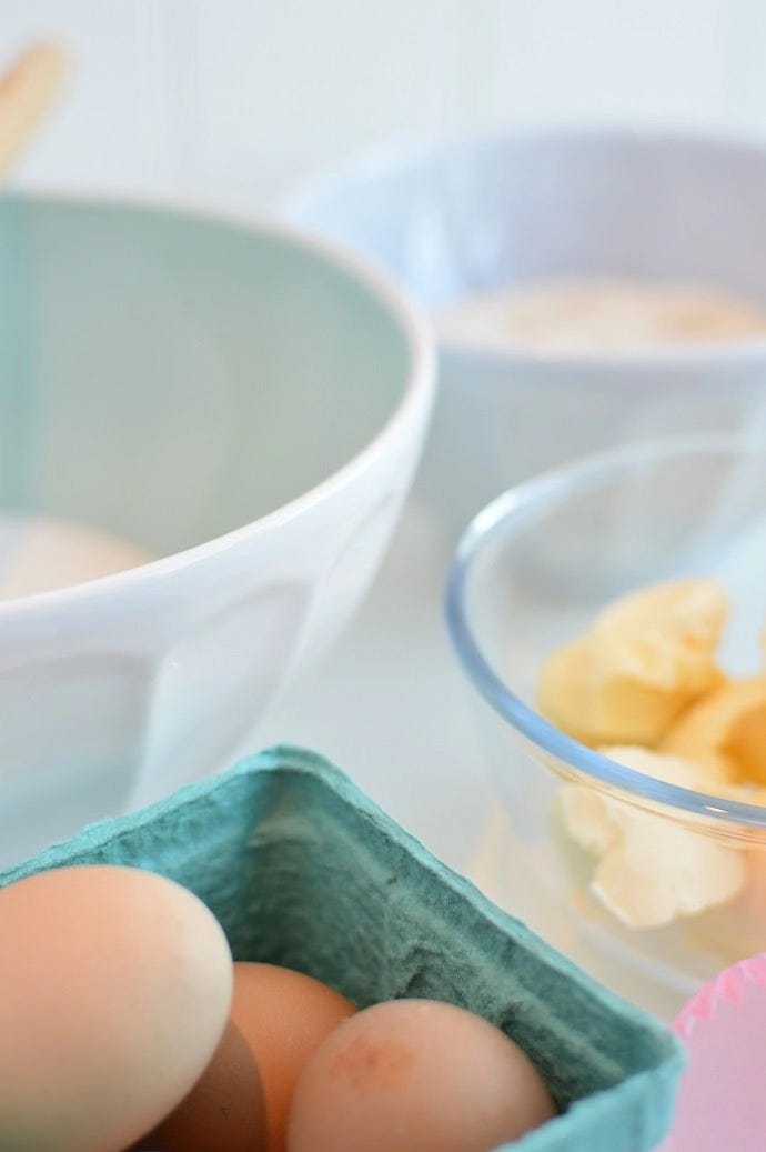 Baking ingredients in bowls - eggs, butter and sugar