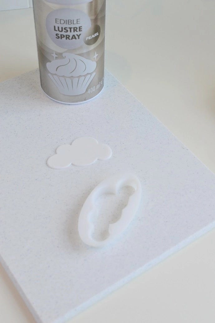 White royal icing cut into the shape of a cloud